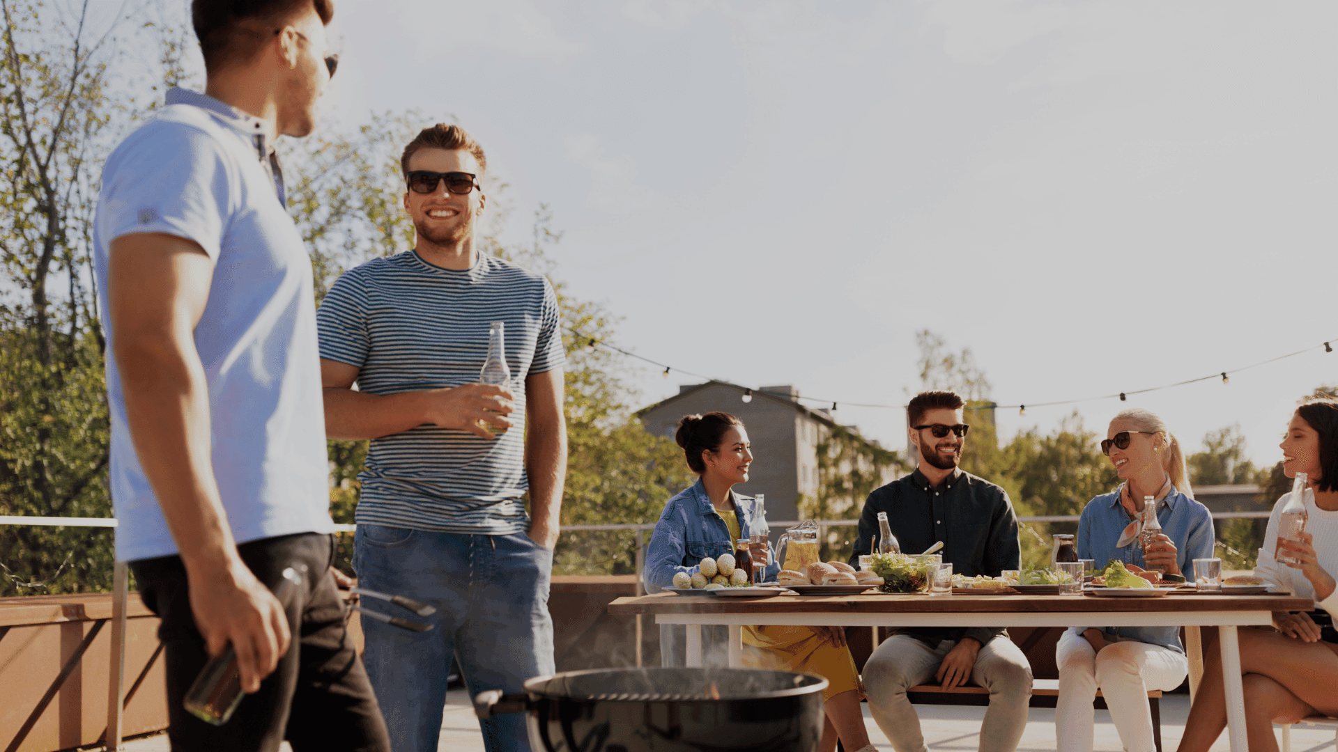 Residents attending a summer BBQ event at an apartment community